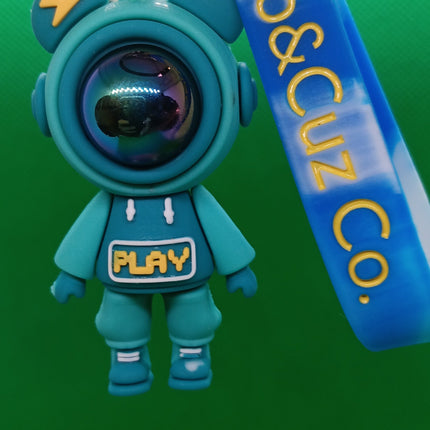 Teal astronaut keychain